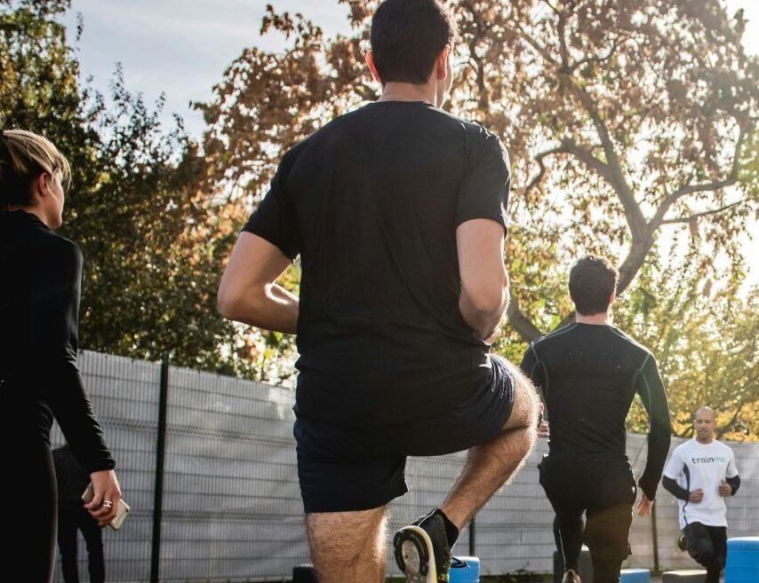 image shows people doing a group training session