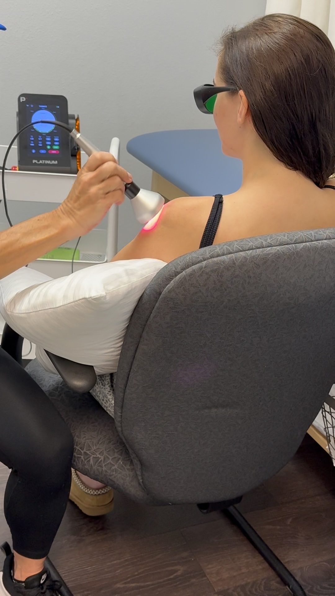 Image show laser therapy being administered.