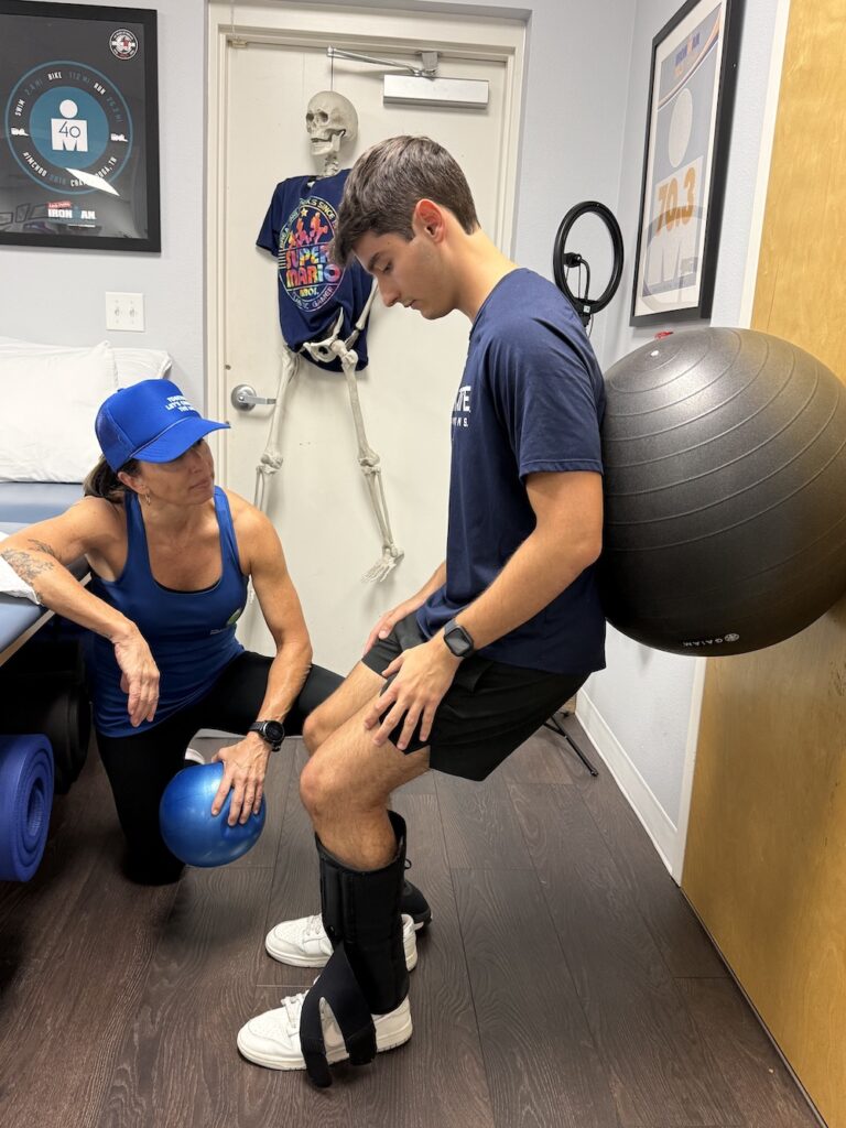 image show man doing resistance excercise with an excersice ball under Dana's instruction
 
