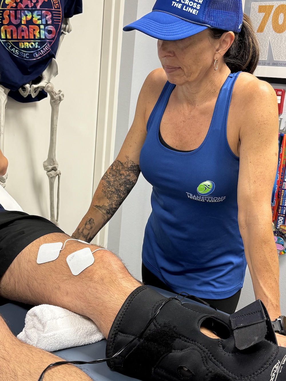 Image shows pads attached to leg for prehap therapy