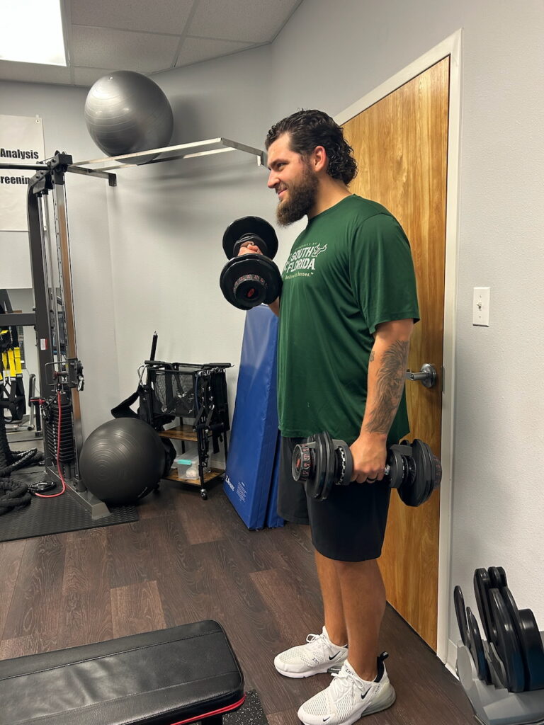 images show training with dumbells